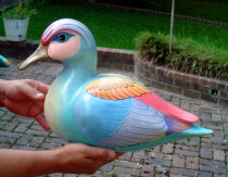 A restored Sergio Bustamante duck sculpture made of paper mache with finely painted feathers,  Universal Fine Art Conservation beautifully 
restored it after the wing was severely dented and broken.