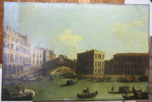 A partially cleaned Canaletto oil painting