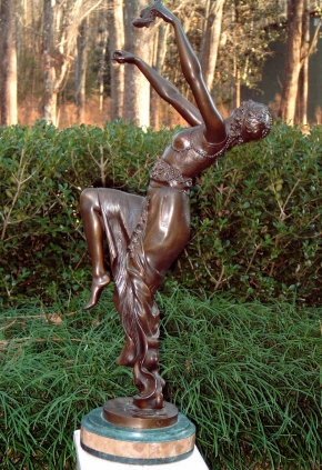 The after picture of a bronze sculpture titled Woman Dancing by Joe Descomps was restored by Universal Fine Art Conservation